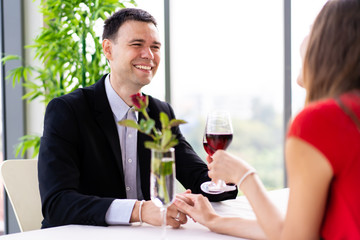  husband and wife having a lunch at restaurant in valentine's day