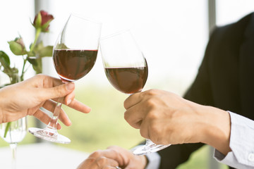 Causasian husband and wife having a lunch together at the sky bar restaurant in valentine's day. Couple dinning together.