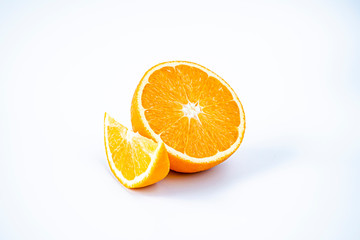 Half and a slice of orange on a white background
