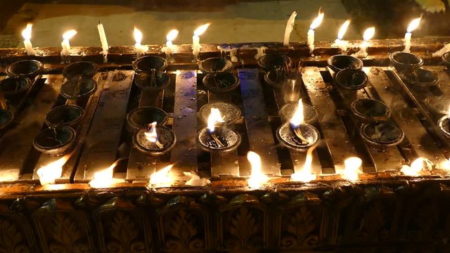 Candles at Shwedagon pagoda in Yangon, Myanmar