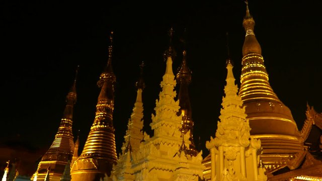 Shwedagon Pagoda, a gilded stupa located in Yangon, Myanmar, panning motion