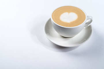 Cup of fresh coffee with heart sign