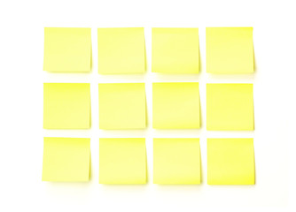 yellow blank sticky note on white wall