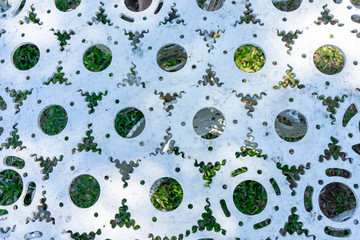 Several white gears are lined up.