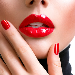 Naklejka premium Closeup beautiful female lips with red lipstick.