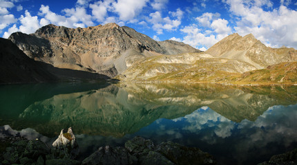 Wild mountain lake in the Altai mountains, summer landscape, beautiful reflection