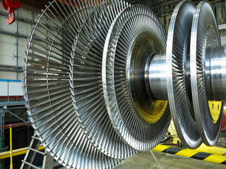 Power generator steam turbine in repair process, machinery, pipes, tubes at power plant