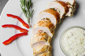 Chicken fillet stuffed with vegetables and bacon