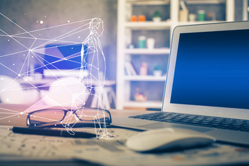 Desktop computer background in office and start up theme hologram drawing. Double exposure. Startup concept.