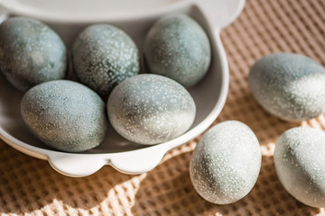 Fototapeta na wymiar Сolored eggs for Easter. Beautiful light blue eggs. Easter background. 