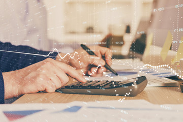 Financial trading graph multi exposure with man desktop background.