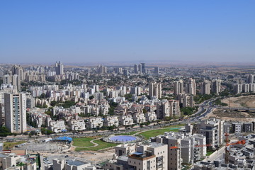 TOP VIEW OF CITY WITH BUILDINGS LAKE AND GREEN FIELDS BEER SHEVA ISRAEL