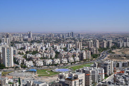 TOP VIEW OF CITY WITH BUILDINGS LAKE AND GREEN FIELDS BEER SHEVA ISRAEL