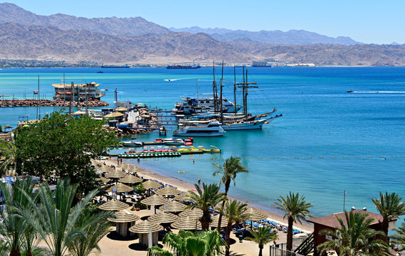 Central public beach in Eilat - Israeli southernmost and famous resort tourist city, located on the northern shores of the Red Sea