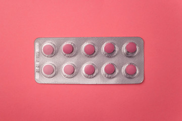 Pink pills in blister pack. Pharmaceutical industry concept. Pharmacy drugstore. 
