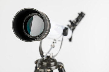 white telescope on tripod isolated on white background.