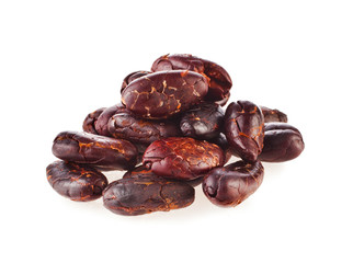 Heap of roasted cacao beans isolated on a white background.