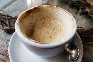 View of a drunk cup of coffee on the table.