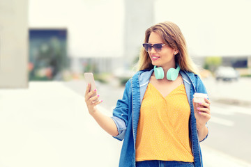 Young woman using mobile phone outdoor