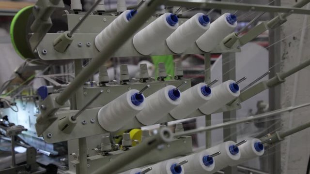 Textile and mattress factory with machines and automatized work
