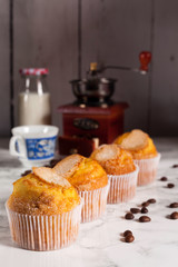four delicious cupcakes and milk bottle
