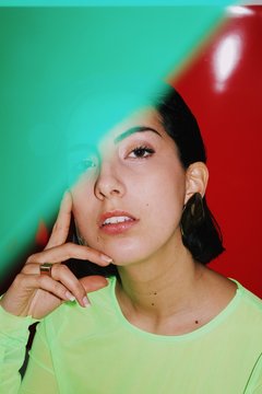 Young woman with neon green shirt and green highlights