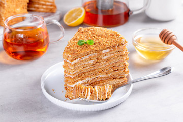 Honey cake on a gray concrete background