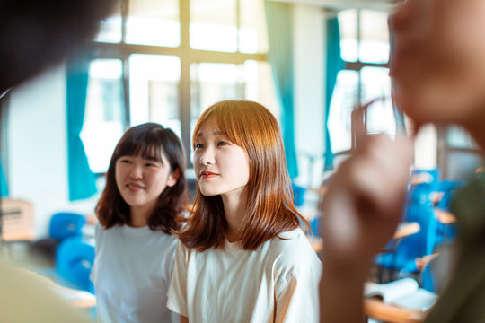 Group of students working on the mathematical problem in classroom