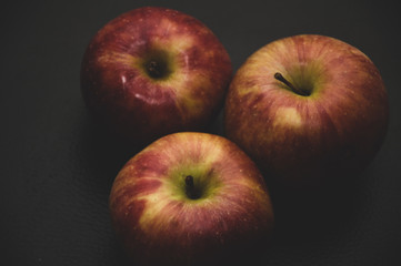 apples on black background