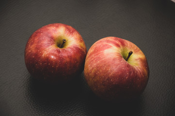 apples on black background