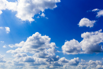 Naklejka na ściany i meble Blue summer sunny sky with white clouds.Background.