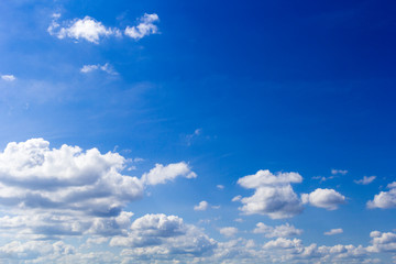 Blue summer sunny sky with white clouds.Background.