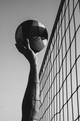 Beach volleyball competition, the ball hit the net, player caught the ball in the net