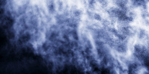 A stream of water and a cloud of drops