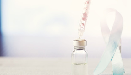 A man signs a medical document. Medical equipment on the table. Stethoscope and ampoules with syringes. Makes notes in the office. Medical center.