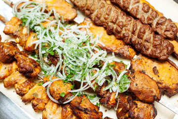 Spiced meat with herbs and onions, fried in tandoor. Shish kebab. Barbecue.