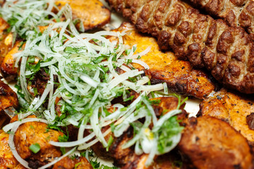 Spiced meat with herbs and onions, fried in tandoor. Shish kebab. Barbecue.