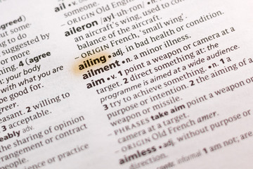 Ivanovsk, Russia - November 19, 2018: The word or phrase Ailing in a dictionary.