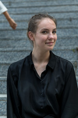 Young Caucasian Woman Smiling at Camera with Head Turned