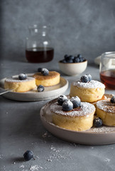 dessert delicious Japanese fluffy pancakes with blueberries and powdered sugar