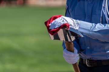 Fire Fighter cleaning axe during a honor guard event