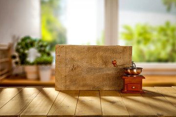 Wooden desk cover of dark shadows and coffee background with window sill 