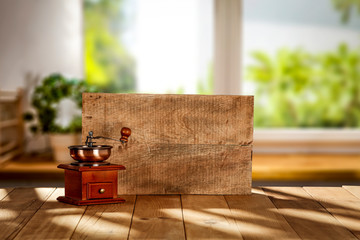Wooden desk cover of dark shadows and coffee background with window sill 
