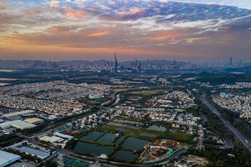 Aerial View of rural green fields in Hong Kong border and skylines in Shenzhen,China