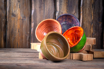 empty decorative bowls for shaving foam on wooden table, close view, barbershop concept 