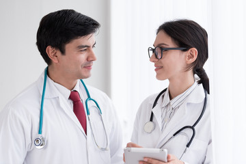 Two doctors have working together with happiness in the hospital.