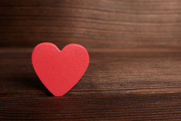 Red heart on wooden background. Valentine's day card.