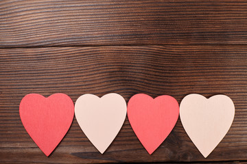 Hearts on wooden background. Valentine's day card.