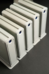 top view of 5 hard drives, on black table
