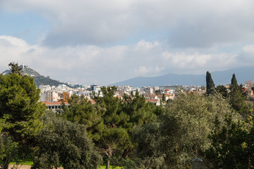 Fototapeta na wymiar View of the center of Athens and the Acropolis on a background of trees